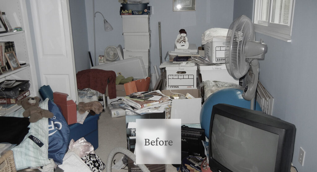Liminal Before Bedroom Cleanup 1 Cluttered room with boxes, papers, a fan, a television, and various household items scattered across the space.