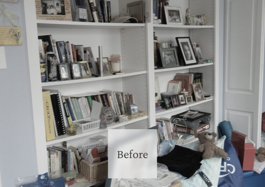 Liminal Before Bedroom Cleanup 2 A cluttered white bookshelf filled with books, framed photos, and decorative items, with a teddy bear and various objects on