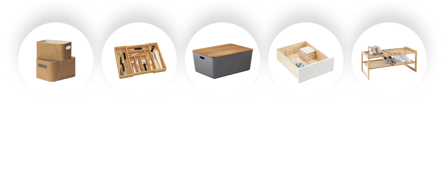 A collection of storage and organization items including cardboard boxes, a cutlery tray, a gray and wooden box, a drawer